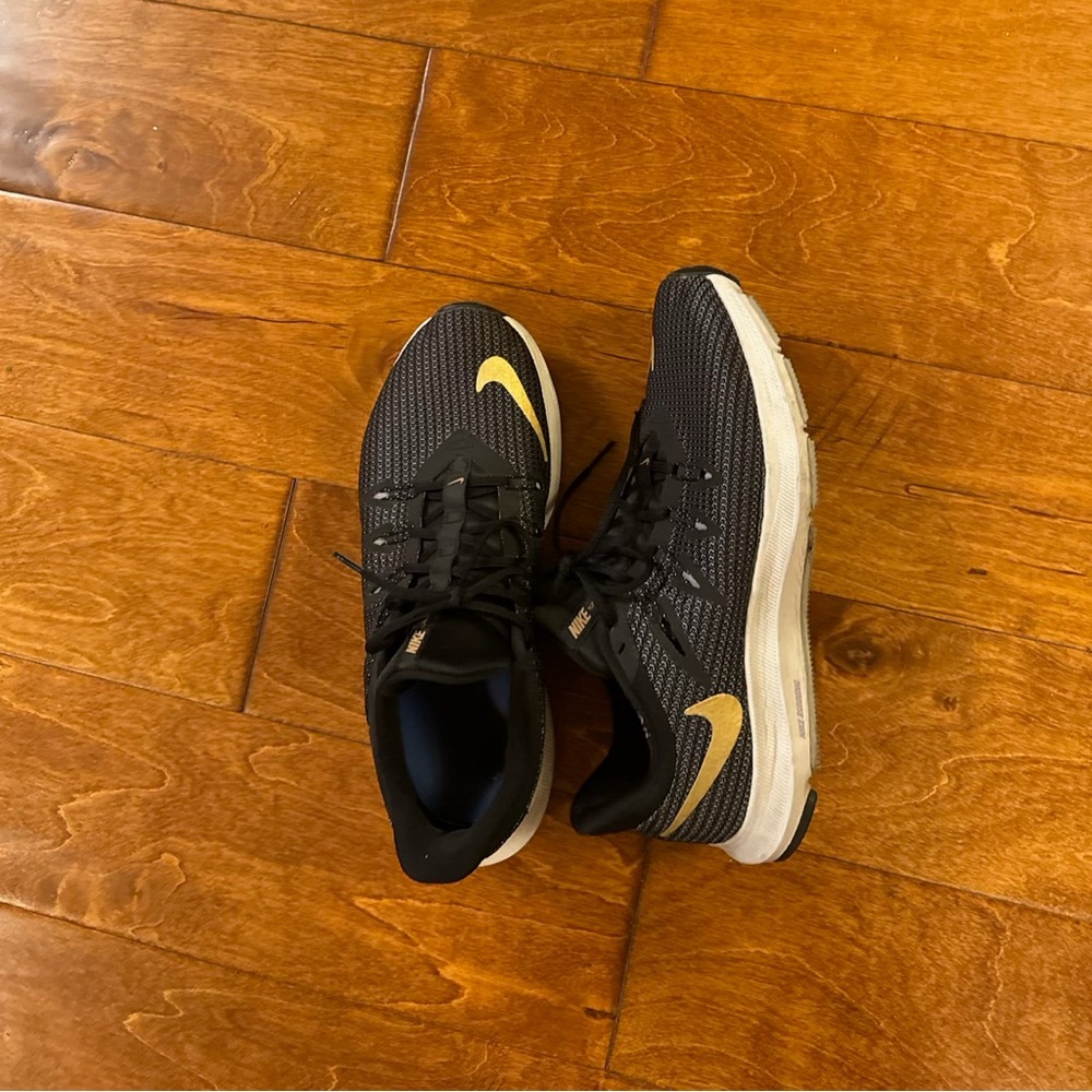 Gold and black Nikes size 8